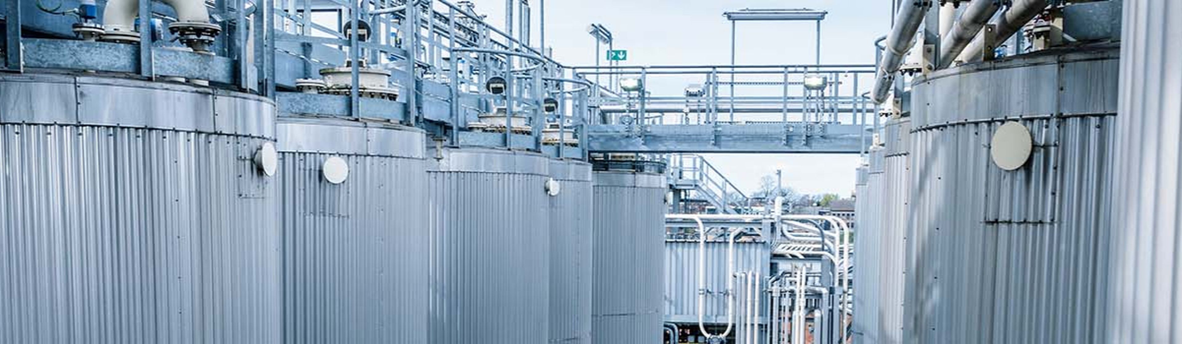Industrial storage tanks and pipelines on the site of the Q8Oils blending plant in Antwerp.